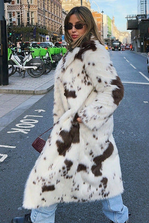 cow fur coat long animal print fluffy overcoat for women worn by model Alicefurs